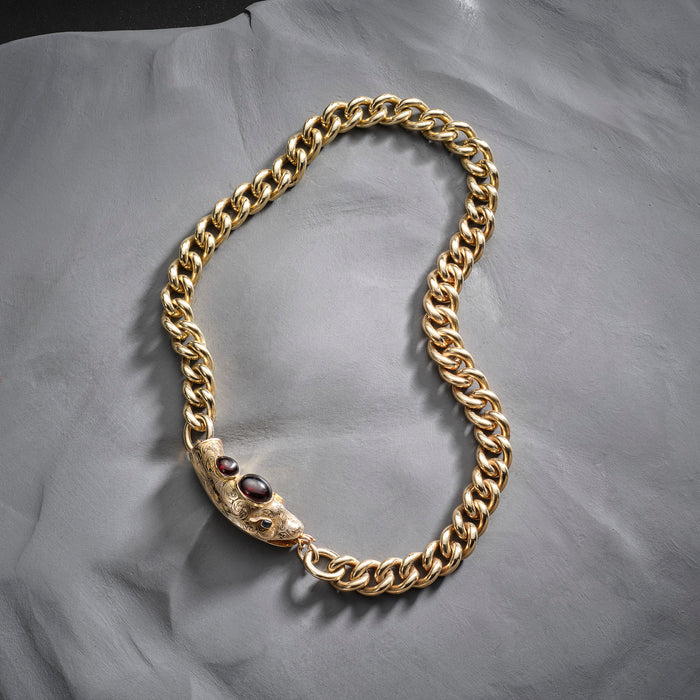 9ct gold curb necklace or bracelet on a Victorian gold snake clasp set with garnets and sapphires.