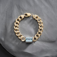 Unique 1970s gold curb bracelet set emerald cut aquamarine in a platinum setting