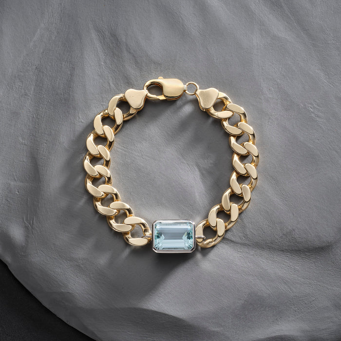 Unique 1970s gold curb bracelet set emerald cut aquamarine in a platinum setting