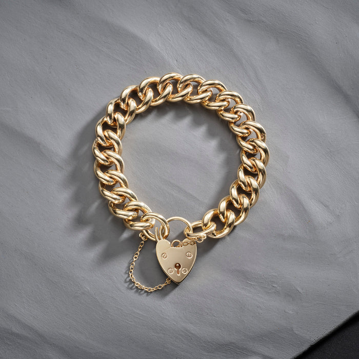 9ct gold curb chain bracelet with heart shaped padlock and safety chain