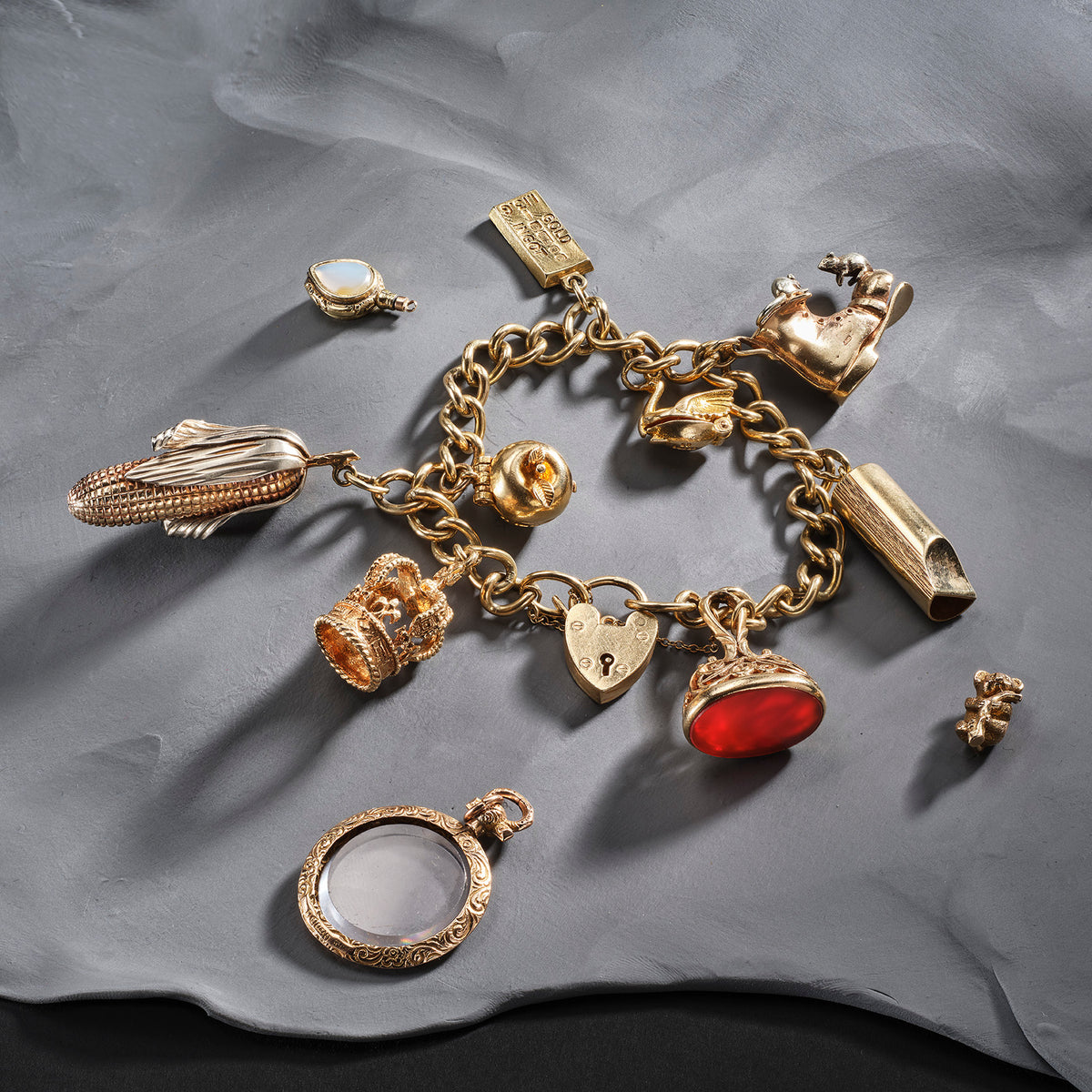 Inherited gold charm bracelet featuring koala, whistle , corn and boot charms