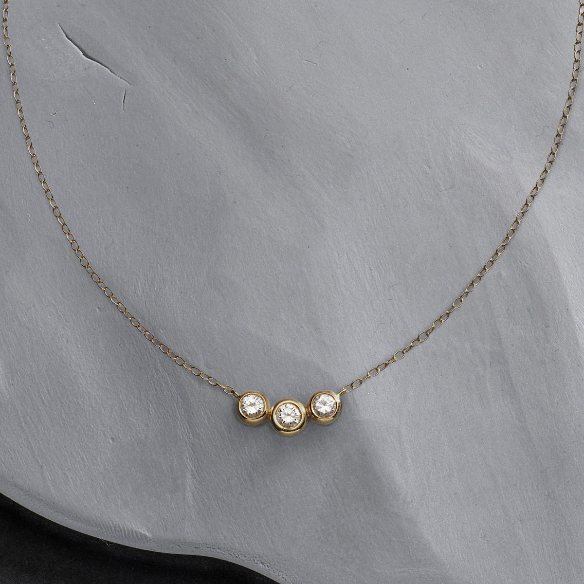 Sisters pendant, unique design by &OR. 18ct gold and bezel set diamond necklace.
